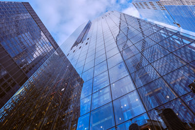 Low angle view of modern buildings against sky