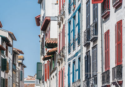 Low angle view of buildings against clear sky