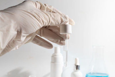 Cropped hand of scientist holding dentures