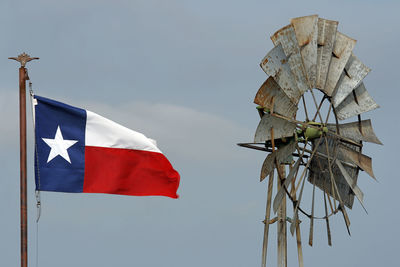 Low angle view of flag against sky