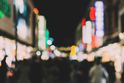 Defocused image of illuminated city at night