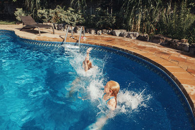 Man swimming in pool