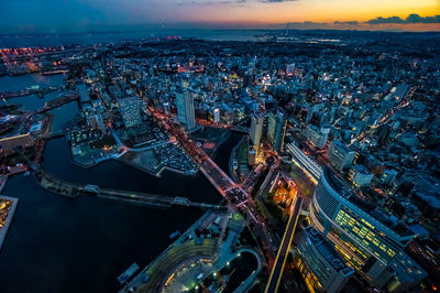 High angle view of illuminated city buildings at night