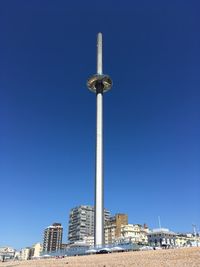 Low angle view of buildings against blue sky