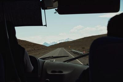 Close-up of car against mountain range