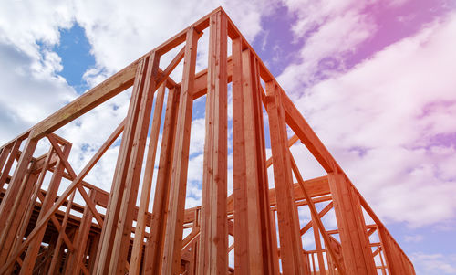 Low angle view of metallic structure against sky