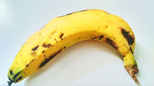 Close-up of bananas against white background