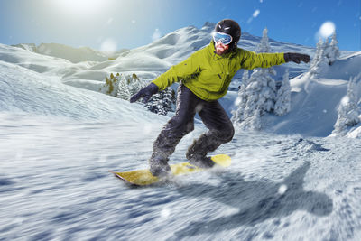 Man skiing on snow covered mountain