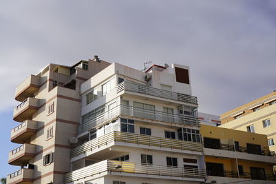 Low angle view of beachside housing in los cristianos, arona, tenerife, canary islands