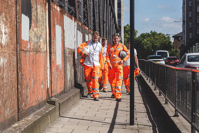 People working at railroad station