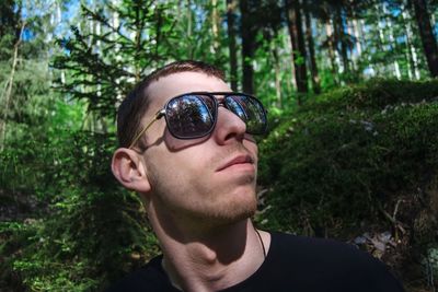 Close-up of young man wearing sunglasses