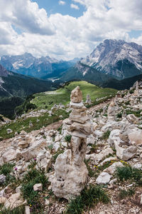 Scenic view of mountains against sky with stone towers