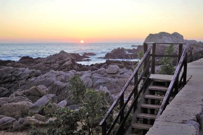 Scenic view of sea against sky during sunset