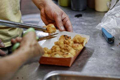 Midsection of man preparing food on table