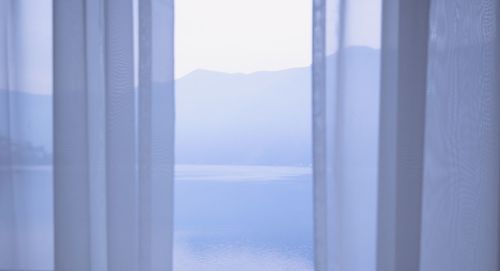 Scenic view of sea seen through window