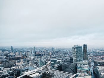 High angle view of buildings in city against sky