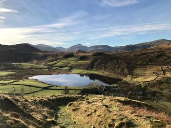 Scenic view of landscape and mountains against sky