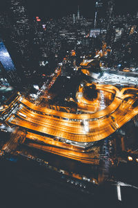 High angle view of illuminated city buildings at night