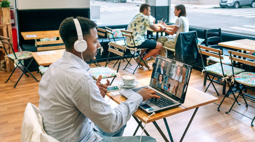 Man in a work meeting by video call