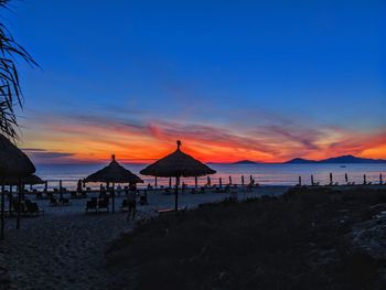 Scenic view of beach against sky during sunset