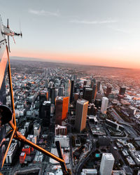 Aerial view of cityscape against sky during sunset