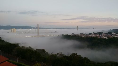 High angle view of city against cloudy sky