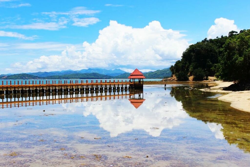 water, sky, tranquil scene, tranquility, cloud - sky, cloud, scenics, reflection, beauty in nature, lake, nature, beach, built structure, mountain, idyllic, blue, calm, sea, pier, day