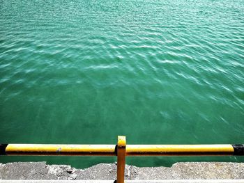 High angle view of yellow ship in sea