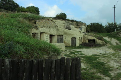 Built structure against cloudy sky