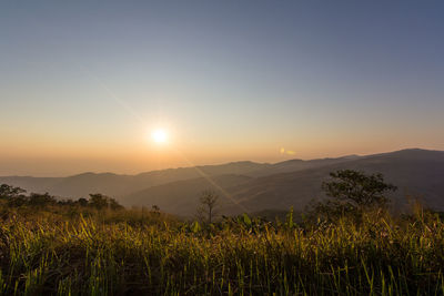 Scenic view of mountains against sky during sunset