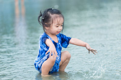 Cute girl in swimming pool