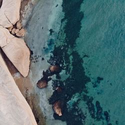 High angle view of pebbles on beach