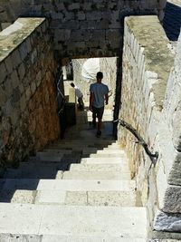 Full length of woman walking on steps