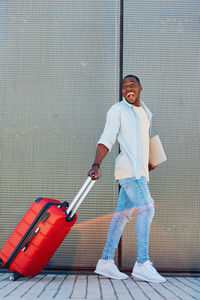 Full length of young man standing on stage