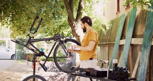 Side view of man riding bicycle