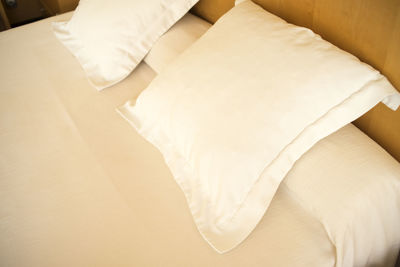 High angle view of pillows on bed