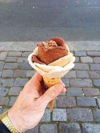 Close-up of woman holding ice cream cone