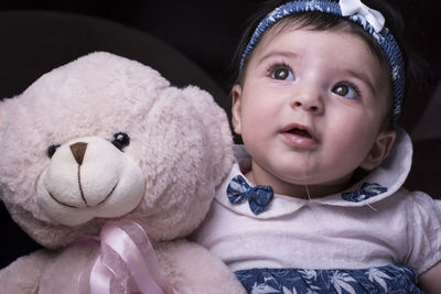 Portrait of cute boy with toy