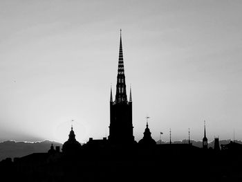 Silhouette of temple against sky
