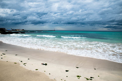 Scenic view of beach against sky