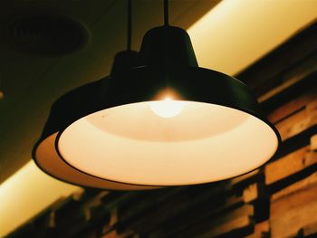 Low angle view of lit lamp