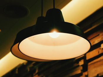 Low angle view of lit lamp