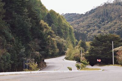 Surface level of country road against clear sky