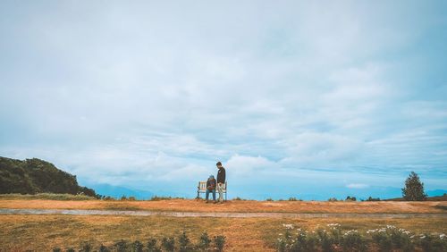 Tractor on field against sky