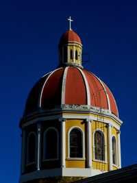 Low angle view of building against blue sky