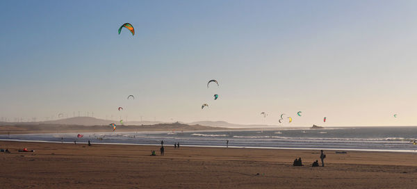 Scenic view of beach against sky during sunset