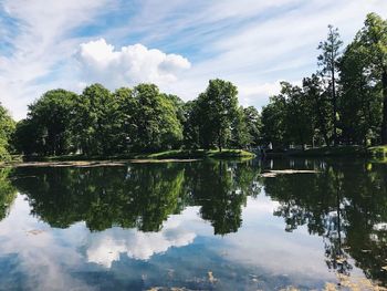 Reflection of trees in lake against sky