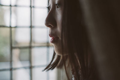 Close-up of young woman looking away