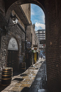 Narrow alley amidst buildings in city