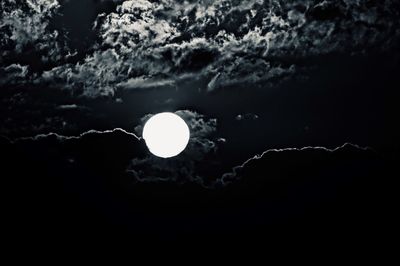 Low angle view of moon against sky at night
